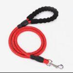 A red heavy duty rope style pet leash with black padded foam hoop handle.