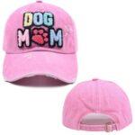 A Pink Distressed ball cap with colorfully chenille patch that reads 'Dog Mom'